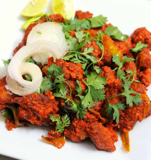South Indian-style spicy deep-fried chicken, served with onions and lemon.