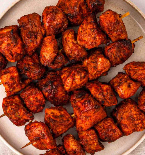 Whole chicken leg marinated in spiced yogurt, threaded on skewers, and oven-cooked. Served with mint chutney.